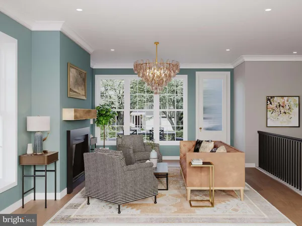 a living room with furniture a fireplace and a chandelier