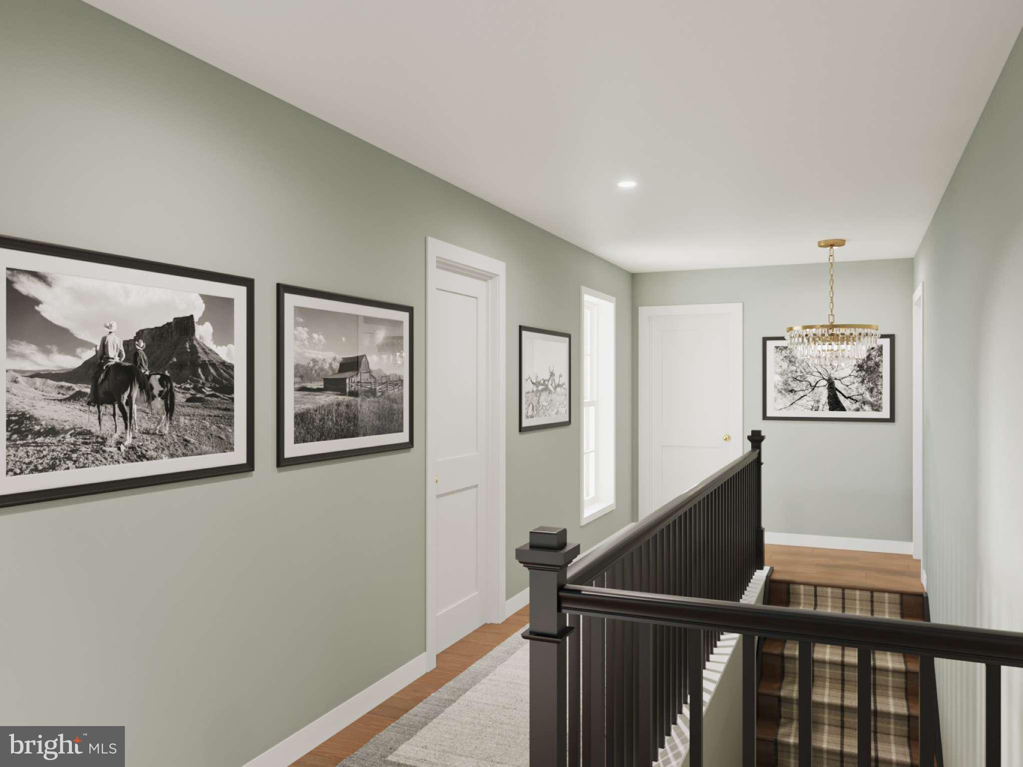 104 Merchant Avenue, Unit BROMLEY Mount Joy, PA 17552 - Photo 9 of 33 a view of a hallway with paintings on the wall