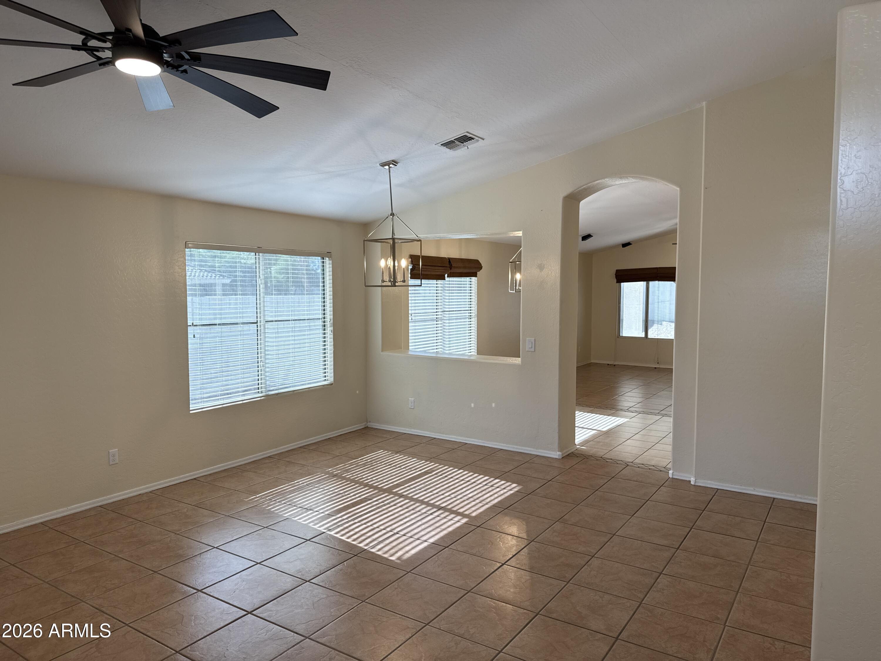 9630 West Reno View Drive Peoria, AZ 85345 - Photo 2 of 21 a view of an empty room and window