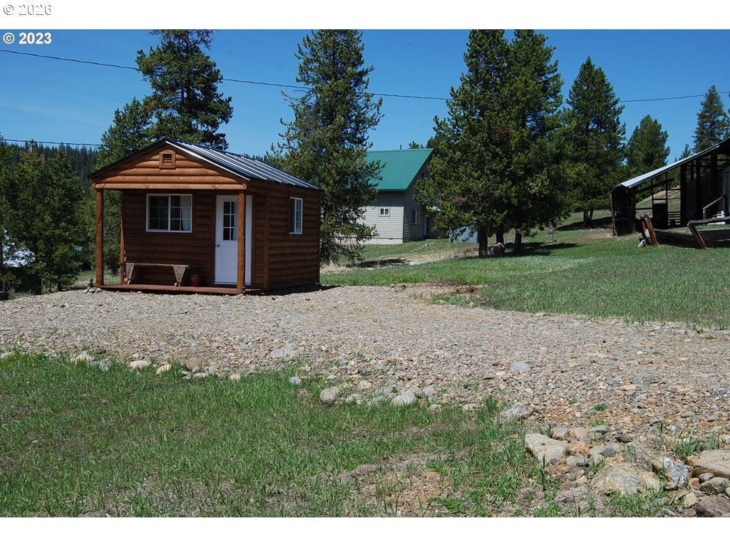1442 Center Street Sumpter, OR 97877 - Photo 13 of 13 a front view of a house with a yard