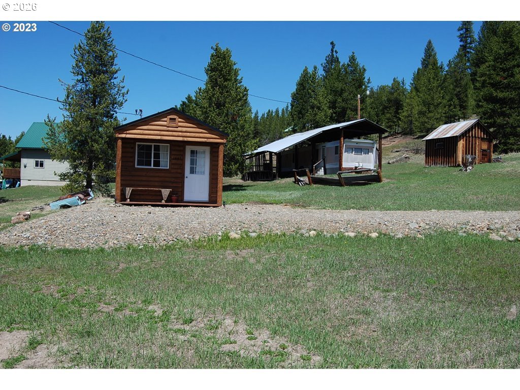 1442 Center Street Sumpter, OR 97877 - Photo 2 of 13 a front view of a house with a yard