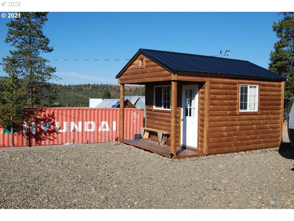 1442 Center Street Sumpter, OR 97877 - Photo 6 of 13 a view of a house with a small yard
