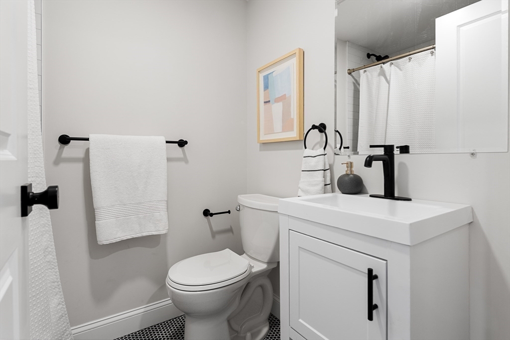 19 George Street, Unit 3 Somerville, MA 02145 - Photo 17 of 20 a bathroom with a sink a toilet and shower