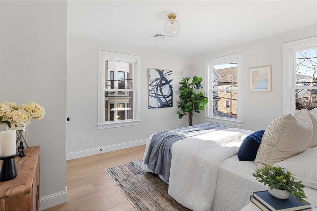 19 George Street, Unit 3 Somerville, MA 02145 - Photo 6 of 20 a bedroom with a bed and window