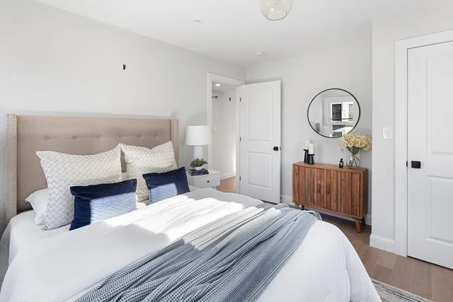 a bedroom with a bed and a dresser