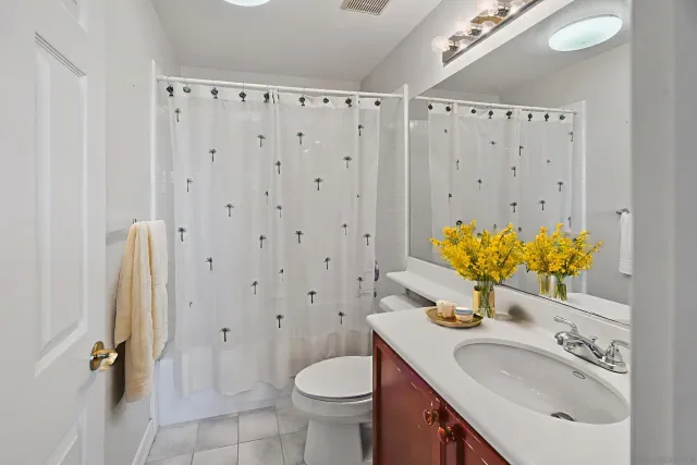 a view of hallway with a large window and front door