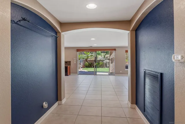 a kitchen with a table and chairs in it