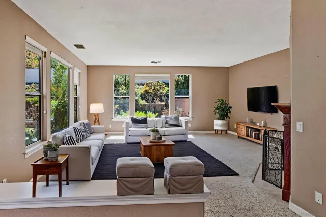 a view of a kitchen with white cabinets