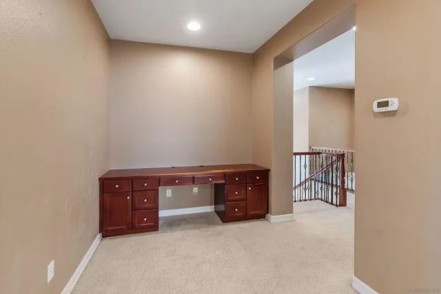 an aerial view of a house with a yard and lake view
