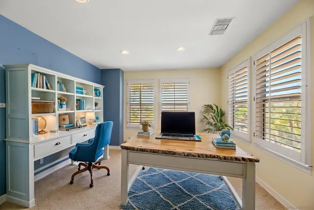 a view of a hallway with windows