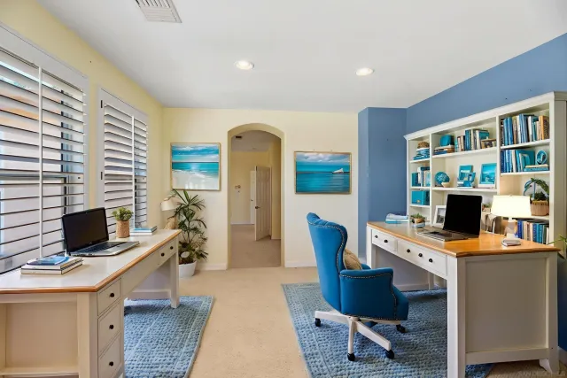 a bedroom with a bed and a flat screen television