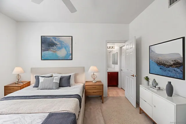 a view of a backyard with swimming pool and sitting area