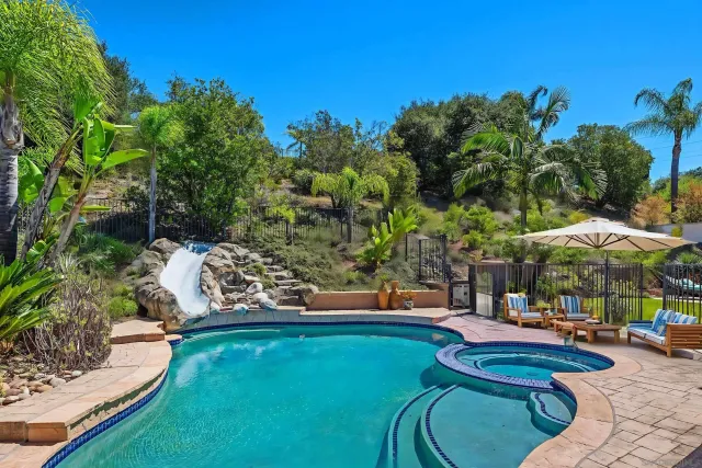 a view of a chair and table in the garden