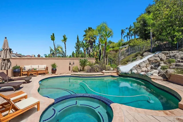 a view of a backyard with plants and a garden