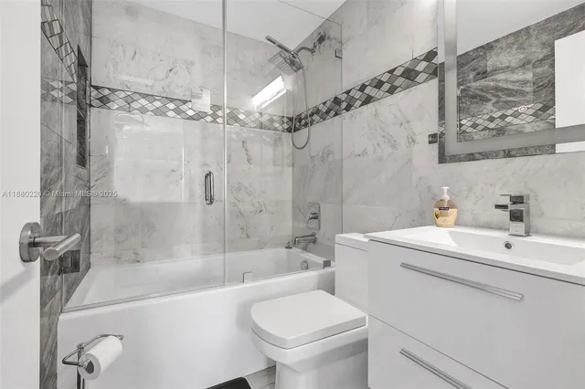 a kitchen with stainless steel appliances a refrigerator and a stove top oven