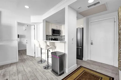 a view of a bathroom from a hallway