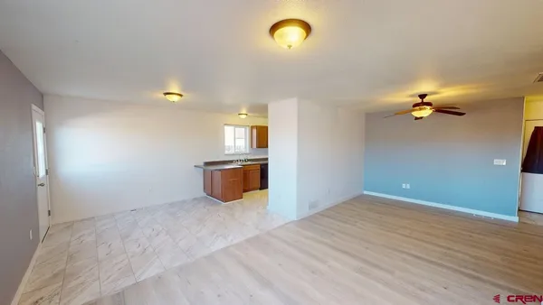 a view of empty room with a fireplace