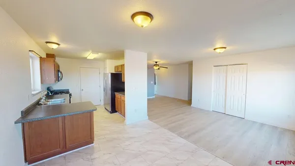 a view of a kitchen with a sink