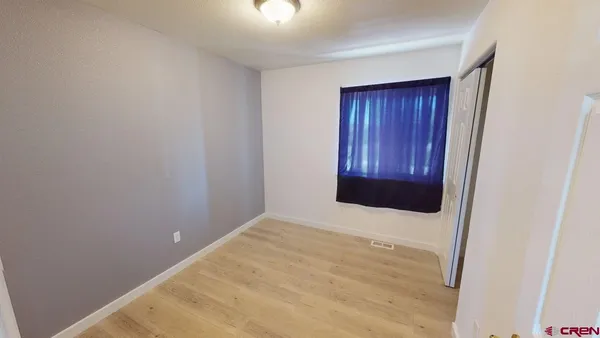 a view of an empty room and window