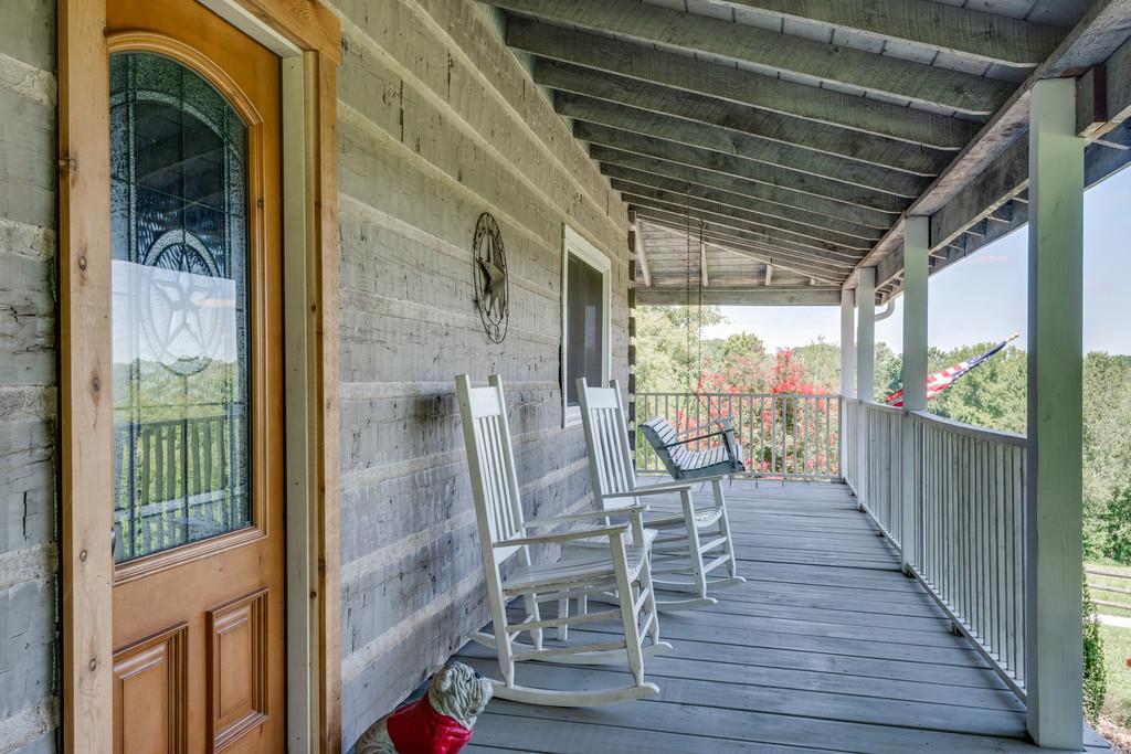 2812 Henry Gower Road Pleasant View, TN 37146 - Photo 4 of 23 a view of a balcony with chairs and wooden floor