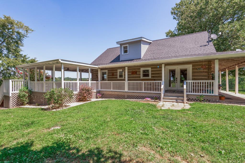2812 Henry Gower Road Pleasant View, TN 37146 - Photo 5 of 23 a view of a house with yard and a garden