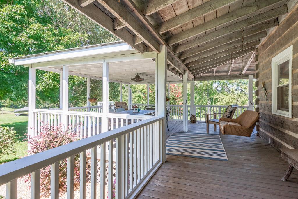 2812 Henry Gower Road Pleasant View, TN 37146 - Photo 9 of 23 a view of balcony with couch and wooden floor
