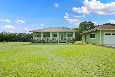 a outdoor view of a house with a garden