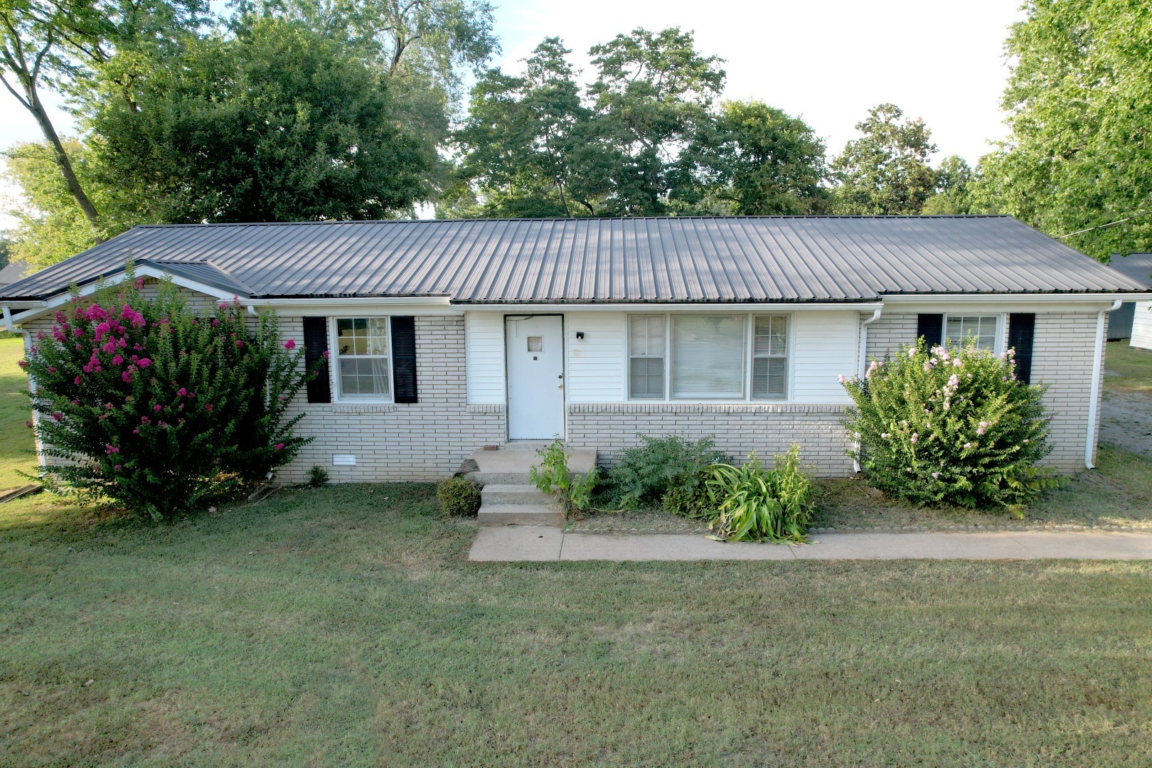 2278 North Ranch Road Murfreesboro, TN 37129 - Photo 13 of 16 a front view of a house with garden
