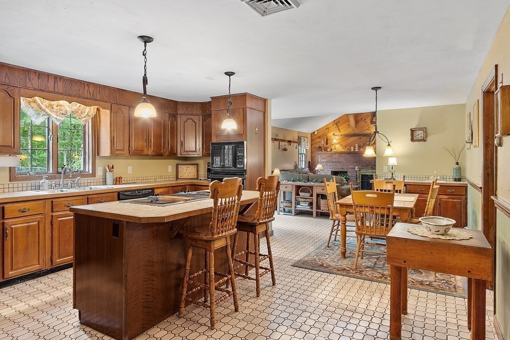 17 Saunders Road Townsend, MA 01474 - Photo 15 of 34 a view of a dining hall with furniture and chandelier