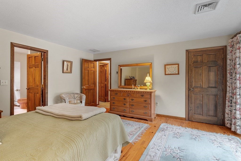 17 Saunders Road Townsend, MA 01474 - Photo 32 of 34 a bedroom with a bed and a dresser