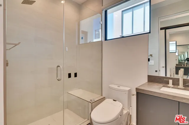 a large kitchen with stainless steel appliances kitchen island a refrigerator sink and stove