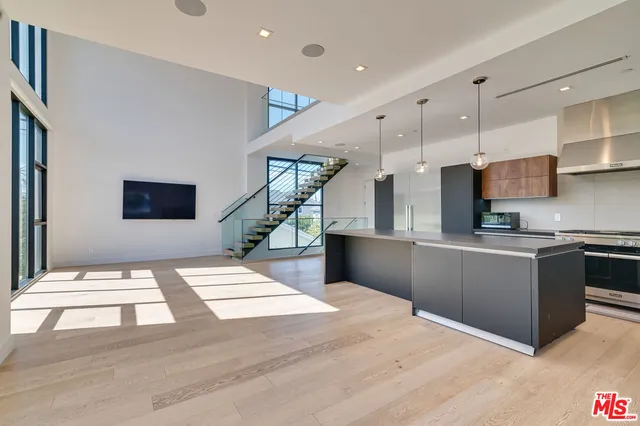 a en suite bathroom with a double vanity sink a mirror and shower