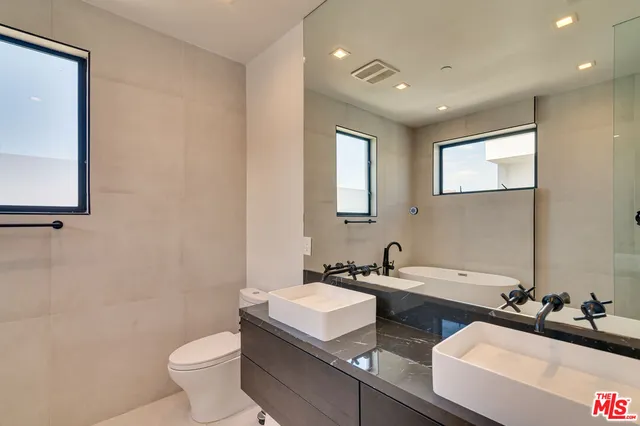 a backyard of a house with outdoor seating