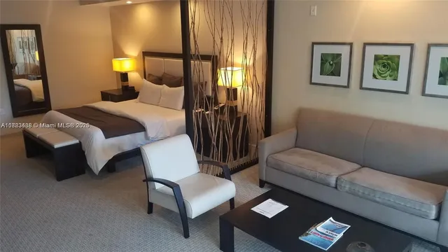 a bedroom with a bed and a couch