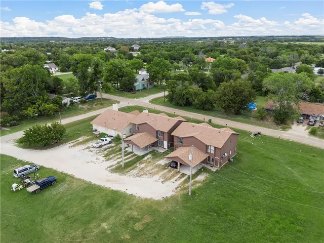 a view of a house with a yard porch and sitting area