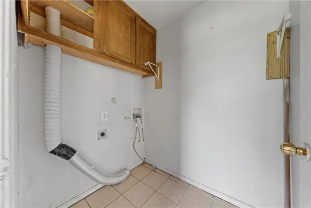 an empty room with a ceiling fan and a window