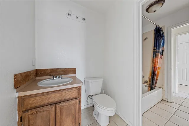 a view of a kitchen with a sink and dishwasher a stove top oven with wooden floor