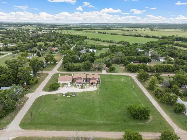 an aerial view of a house with a garden