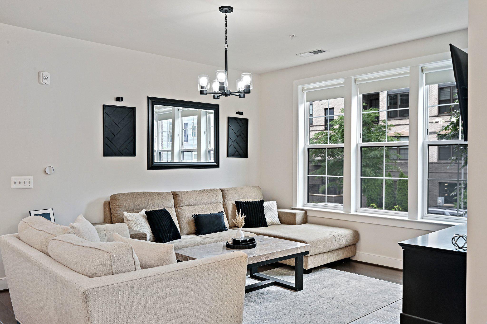 2320 Field Point Road, Unit 4102 Herndon, VA 20171 - Photo 9 of 39 a living room with furniture and windows