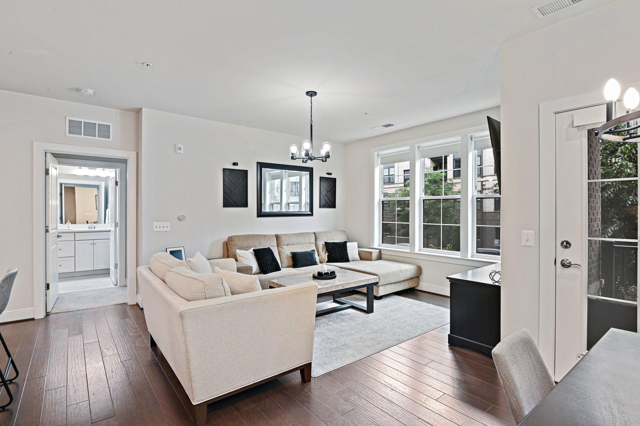 2320 Field Point Road, Unit 4102 Herndon, VA 20171 - Photo 14 of 39 a living room with furniture and wooden floor