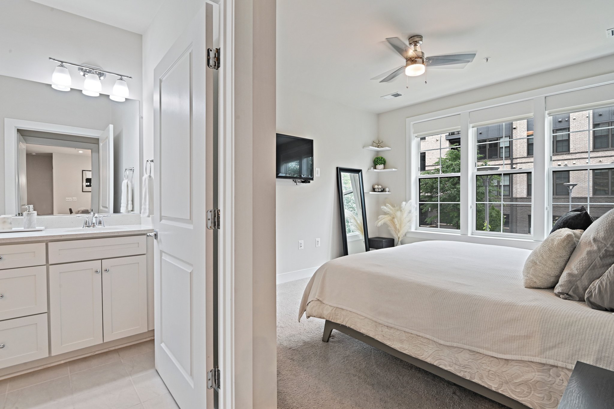 2320 Field Point Road, Unit 4102 Herndon, VA 20171 - Photo 15 of 39 a bedroom with a bed a mirror and a window