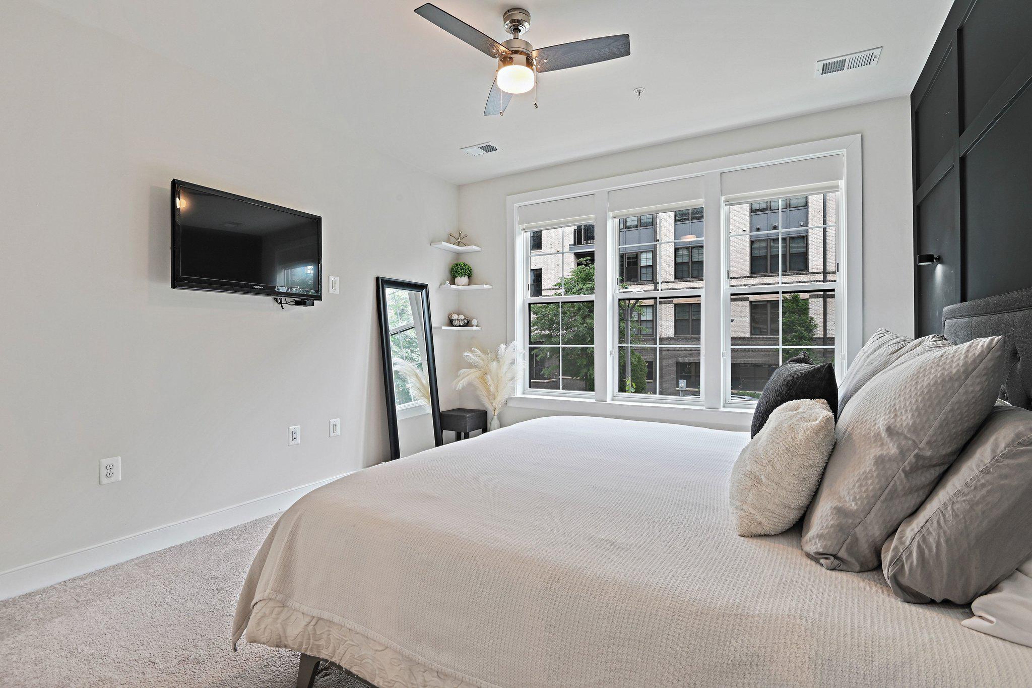 2320 Field Point Road, Unit 4102 Herndon, VA 20171 - Photo 17 of 39 a bed room with a bed and a television