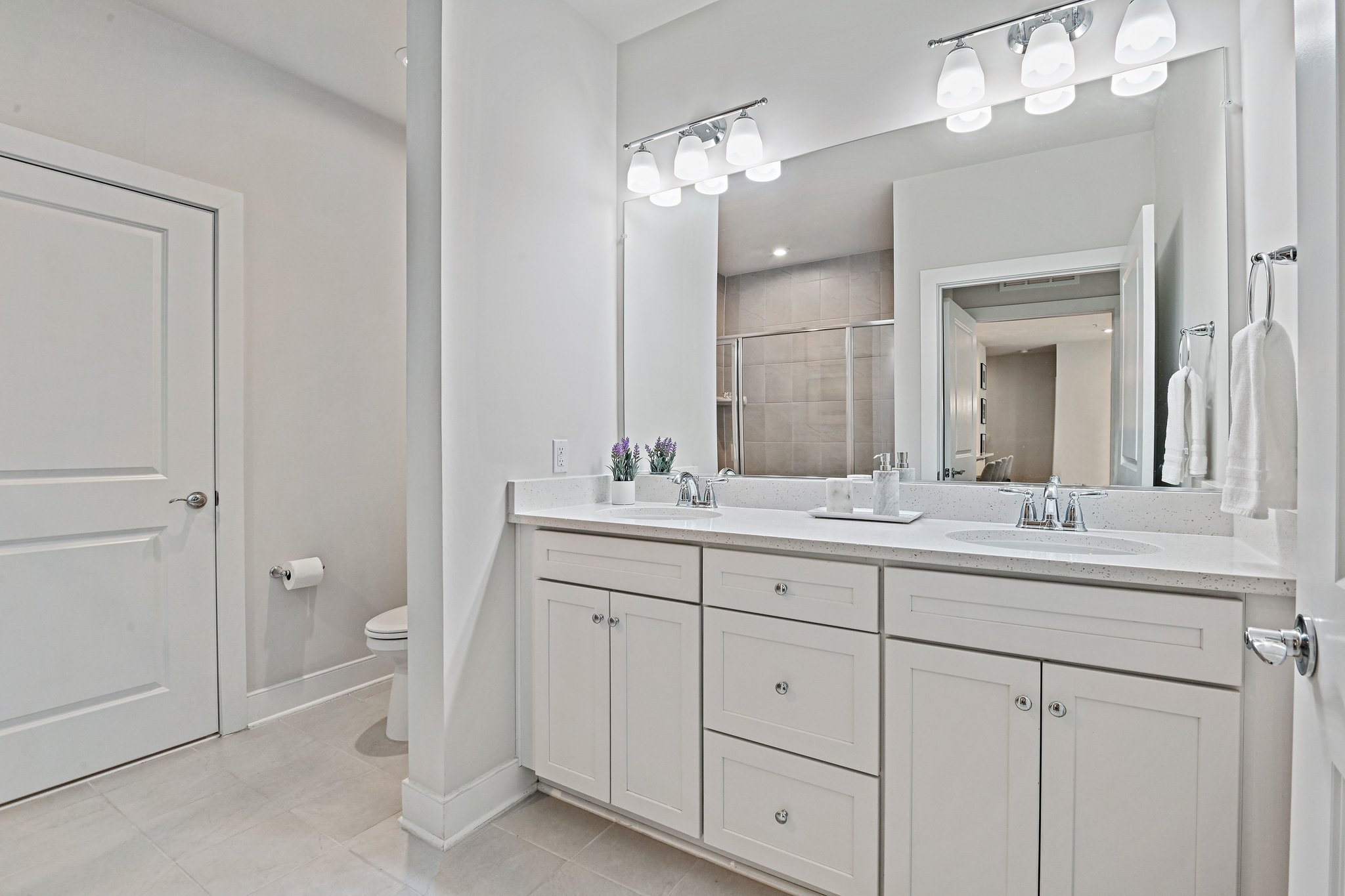 2320 Field Point Road, Unit 4102 Herndon, VA 20171 - Photo 19 of 39 a bathroom with a double vanity sink and a mirror