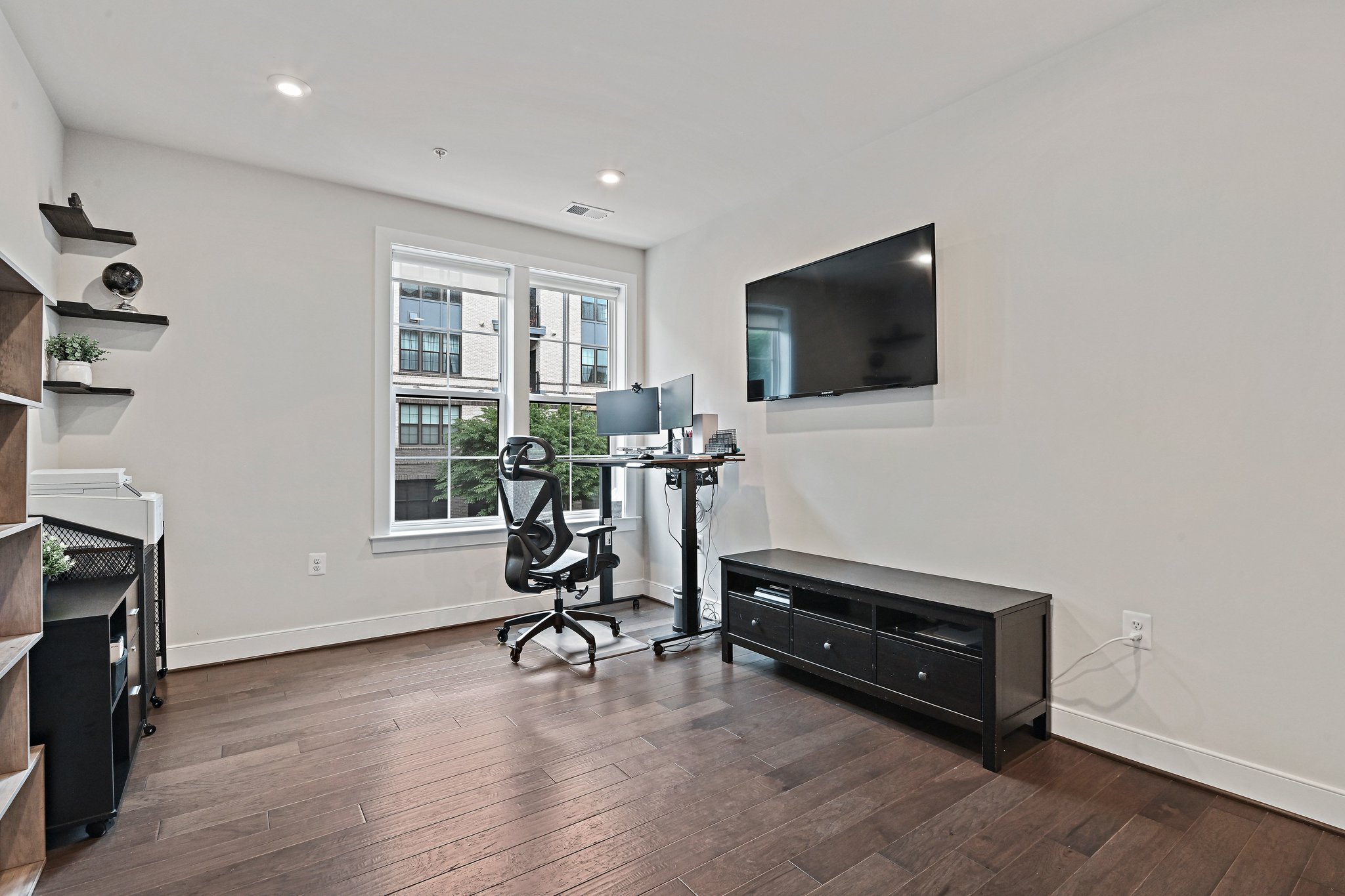 2320 Field Point Road, Unit 4102 Herndon, VA 20171 - Photo 24 of 39 a living room with furniture a flat screen tv and a window