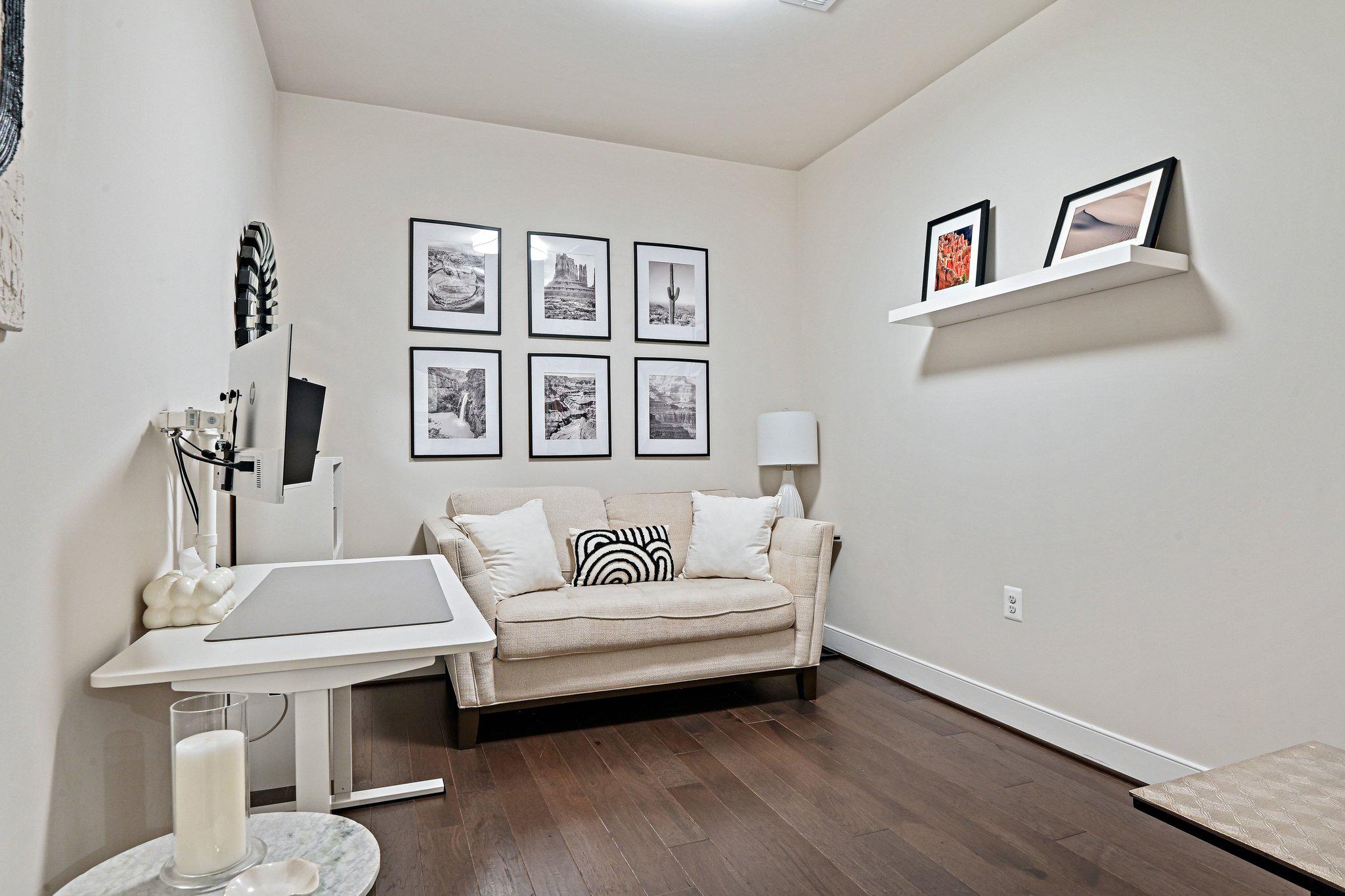 2320 Field Point Road, Unit 4102 Herndon, VA 20171 - Photo 26 of 39 a living room with furniture and a painting on the wall