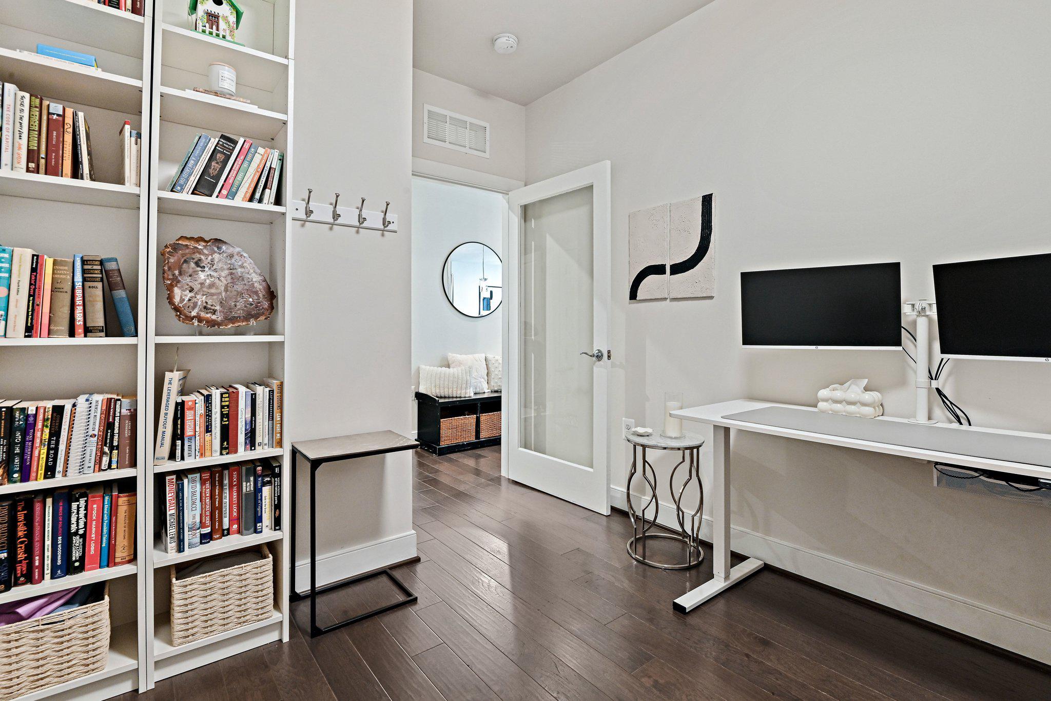 2320 Field Point Road, Unit 4102 Herndon, VA 20171 - Photo 27 of 39 a view of a workspace with bookshelf