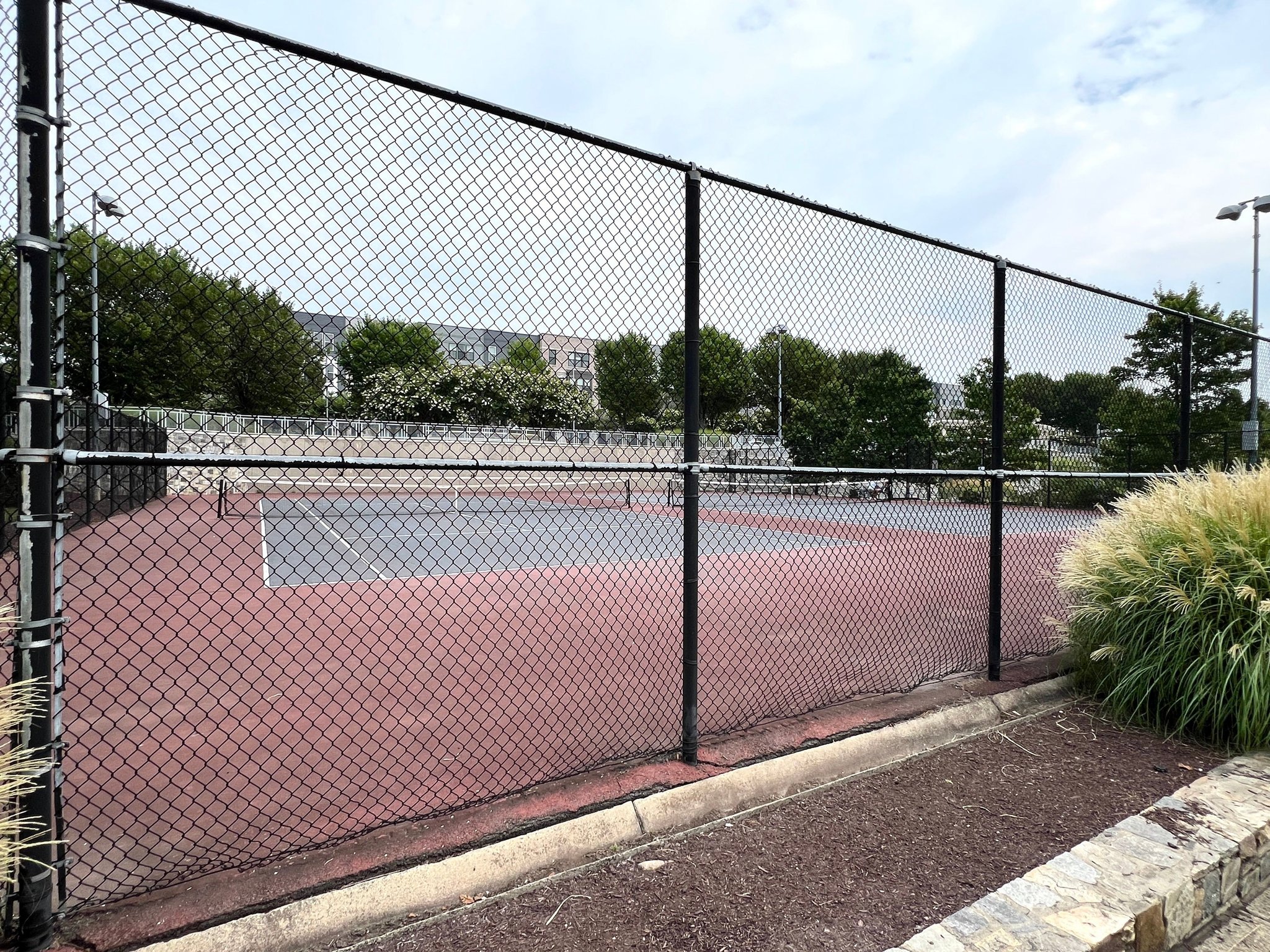 2320 Field Point Road, Unit 4102 Herndon, VA 20171 - Photo 30 of 39 a view of a tennis court with a tennis court