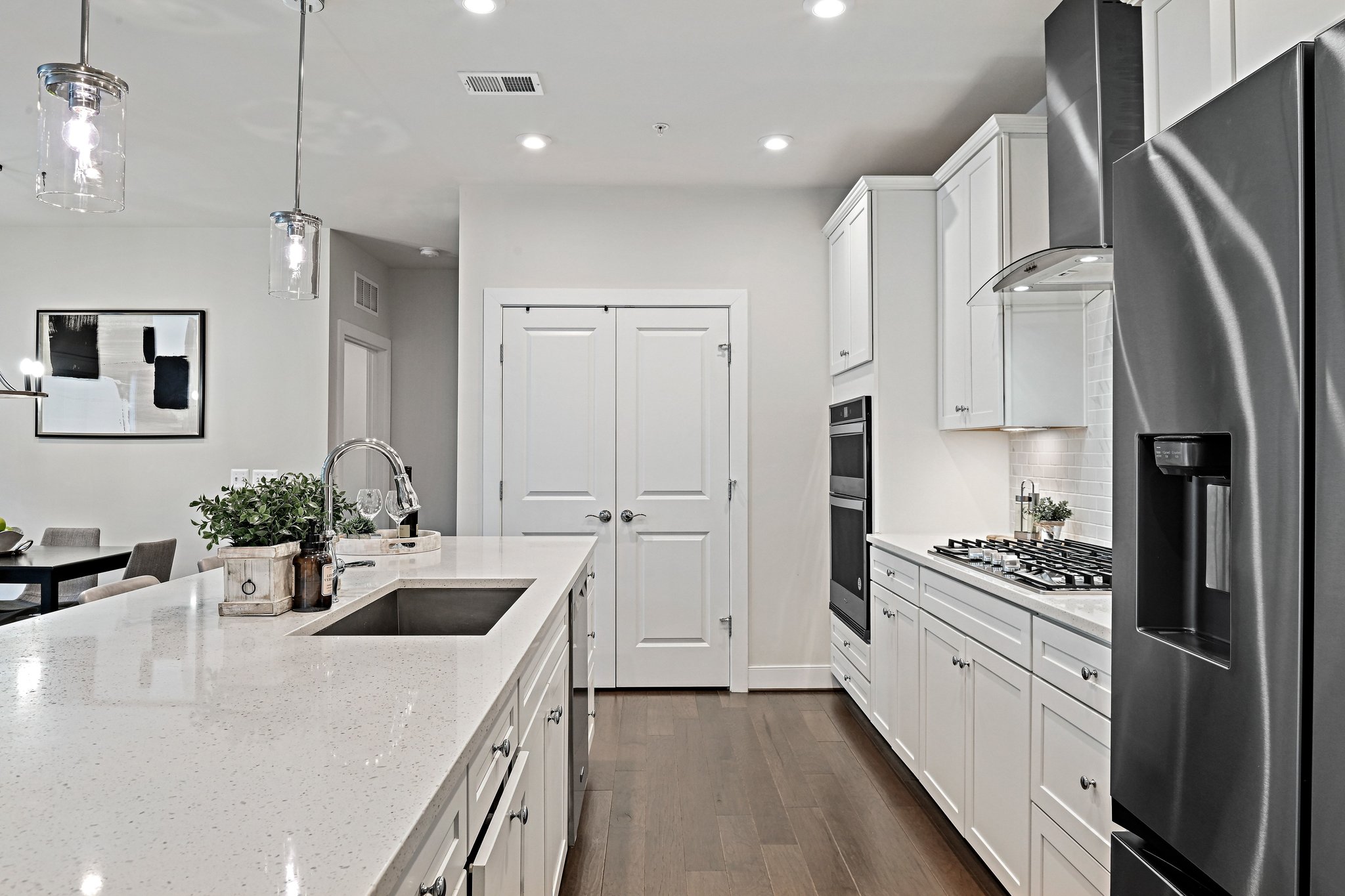 2320 Field Point Road, Unit 4102 Herndon, VA 20171 - Photo 4 of 39 a kitchen with white cabinets and stainless steel appliances