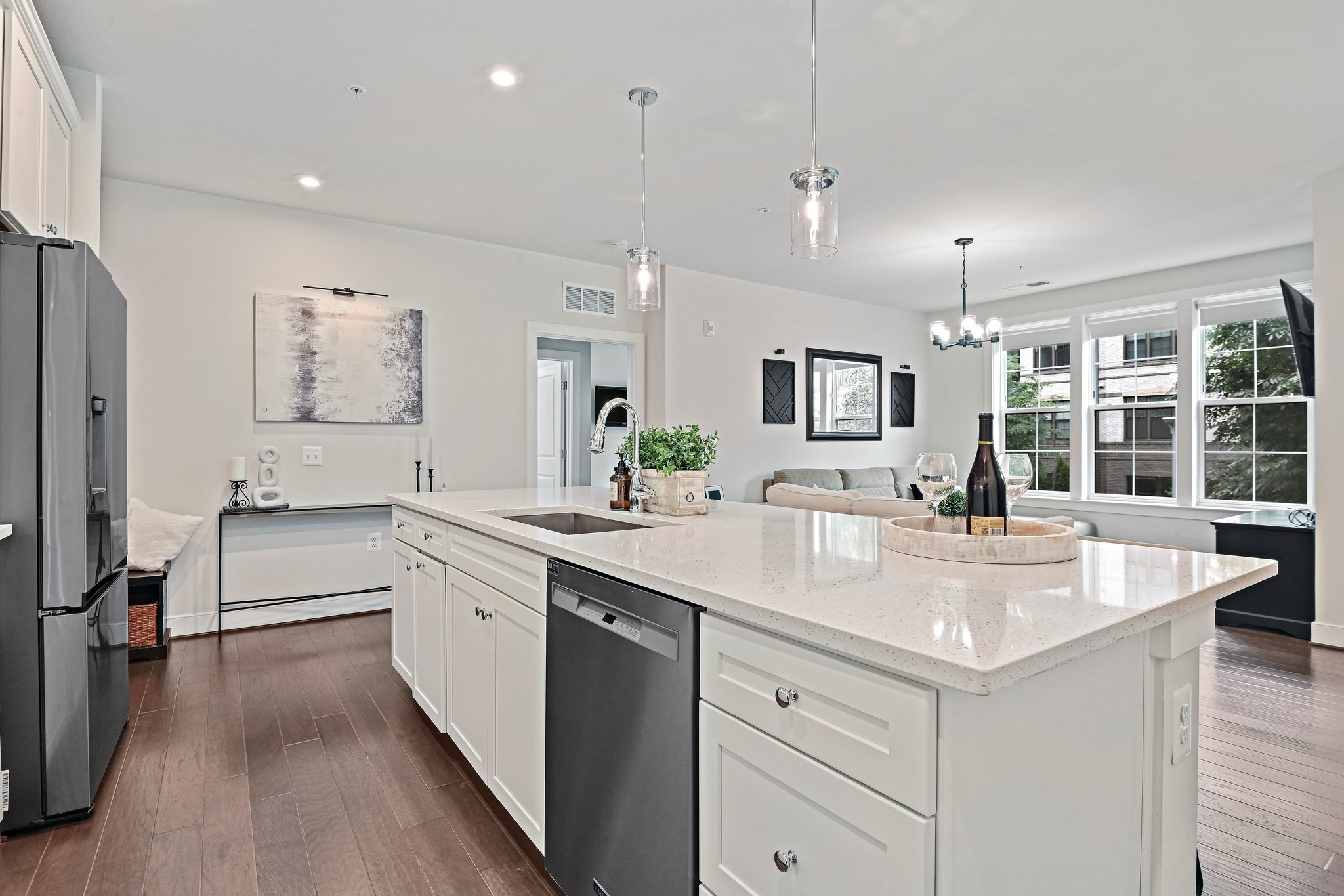 2320 Field Point Road, Unit 4102 Herndon, VA 20171 - Photo 6 of 39 a large white kitchen with a lot of counter space and a sink
