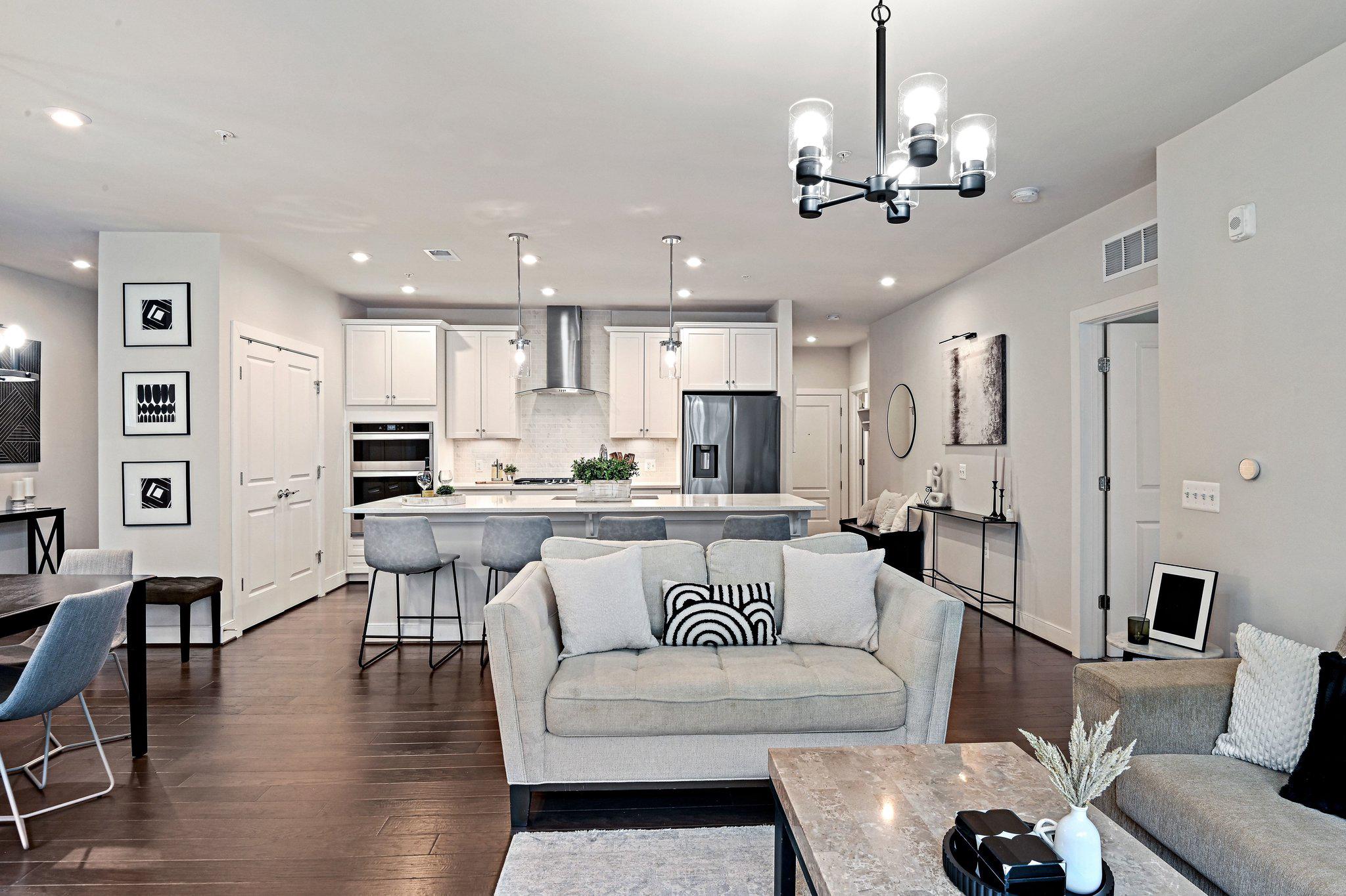 2320 Field Point Road, Unit 4102 Herndon, VA 20171 - Photo 39 of 39 a living room with furniture kitchen and a chandelier